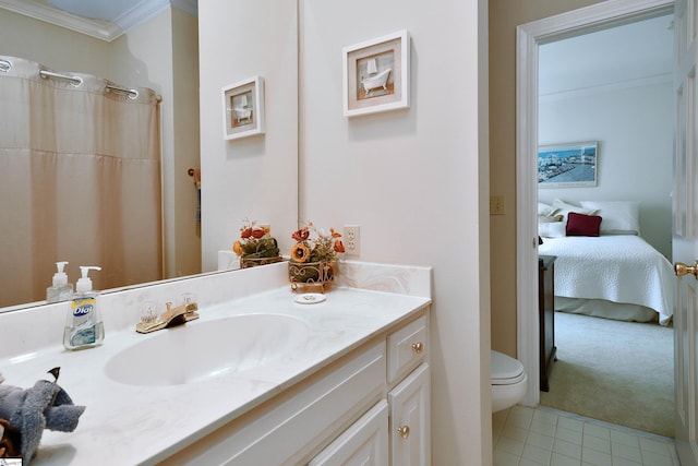 bathroom with vanity, tile patterned flooring, crown molding, and toilet