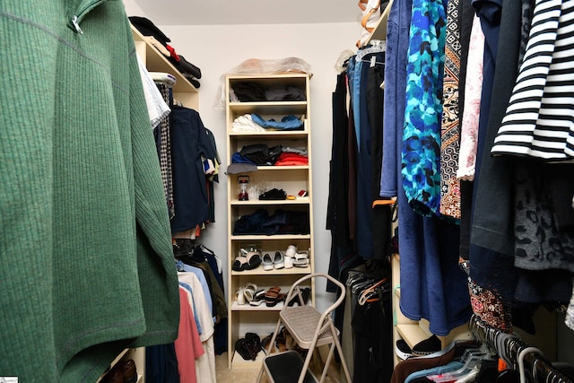 walk in closet with tile patterned floors