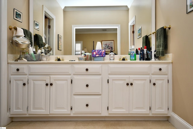 bathroom with vanity and ornamental molding