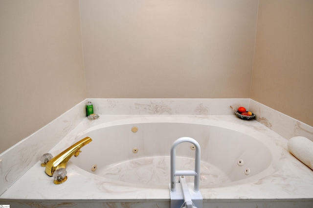 bathroom featuring tiled tub