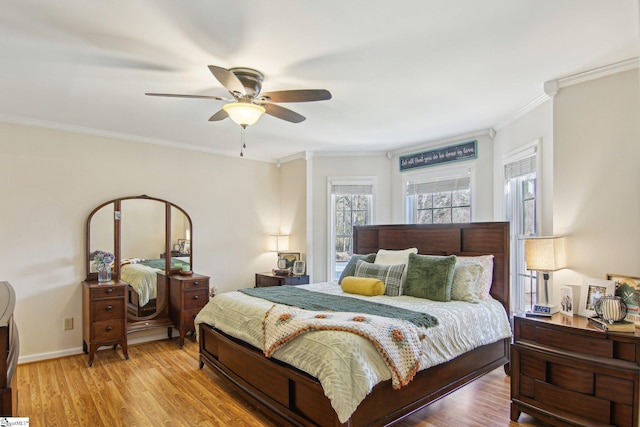 bedroom with light wood-type flooring, ceiling fan, and ornamental molding