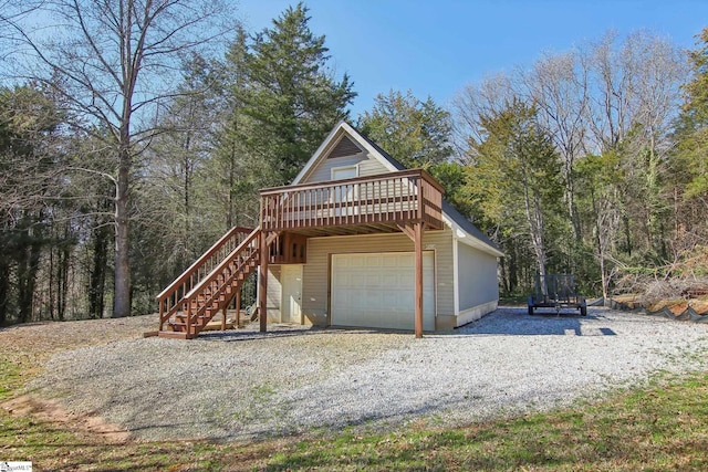 view of front facade with a trampoline, a deck, and a garage