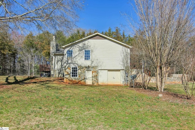 view of side of property with a yard