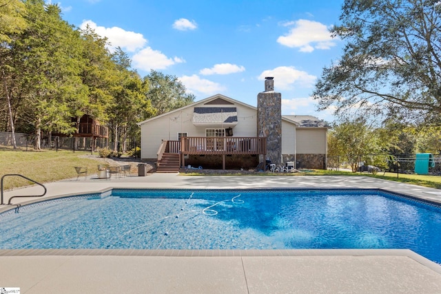 view of pool with a wooden deck