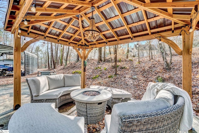 view of patio with a fire pit and a gazebo