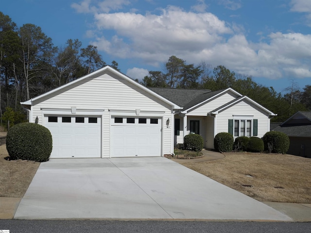 ranch-style home featuring driveway and an attached garage