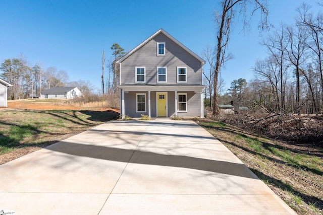 view of property featuring covered porch