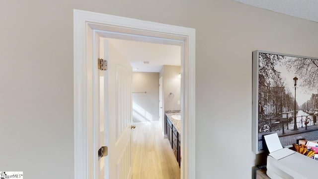 hallway with light wood-type flooring