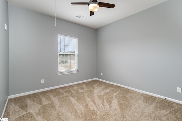 empty room with ceiling fan and carpet floors