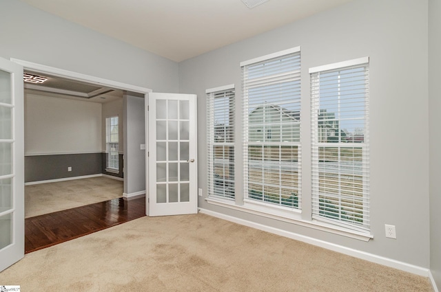 carpeted empty room with french doors