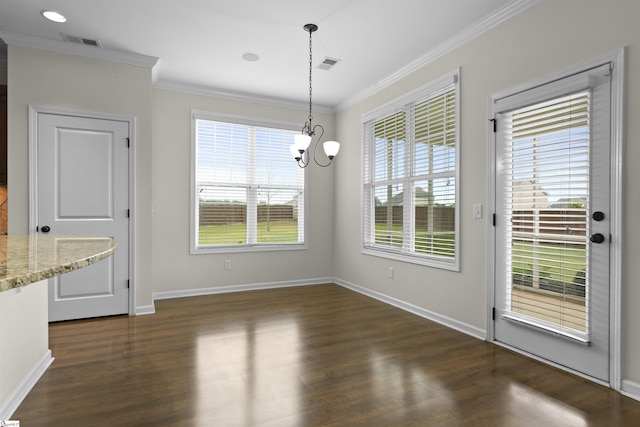 unfurnished dining area with dark hardwood / wood-style floors, a chandelier, and ornamental molding