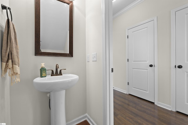 bathroom with hardwood / wood-style floors