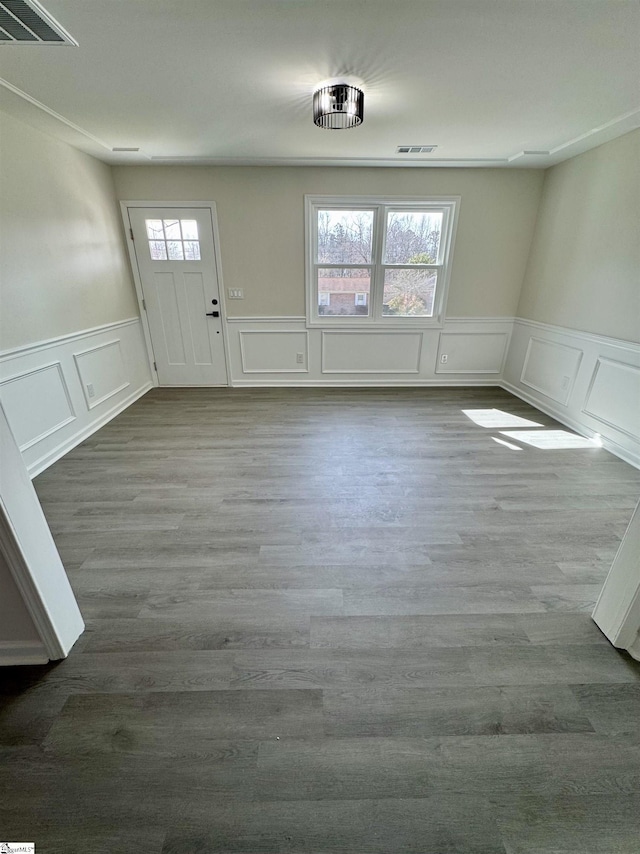 foyer entrance featuring hardwood / wood-style floors and a wealth of natural light