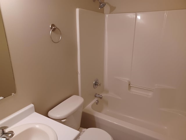 full bathroom with sink, bathing tub / shower combination, and toilet