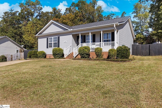 ranch-style house featuring a front yard and a porch