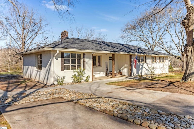 ranch-style house with covered porch