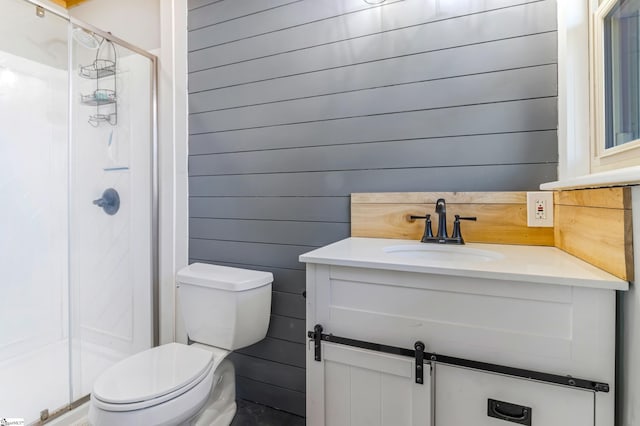 bathroom with toilet, vanity, walk in shower, and wooden walls