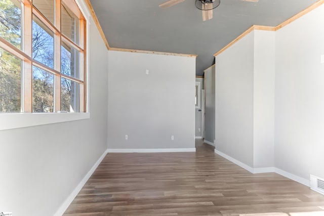 unfurnished room featuring ornamental molding, ceiling fan, and wood-type flooring