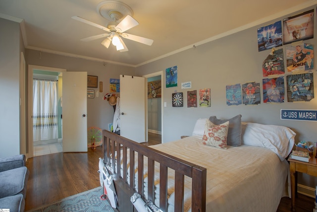 bedroom featuring dark wood-type flooring, crown molding, and ceiling fan