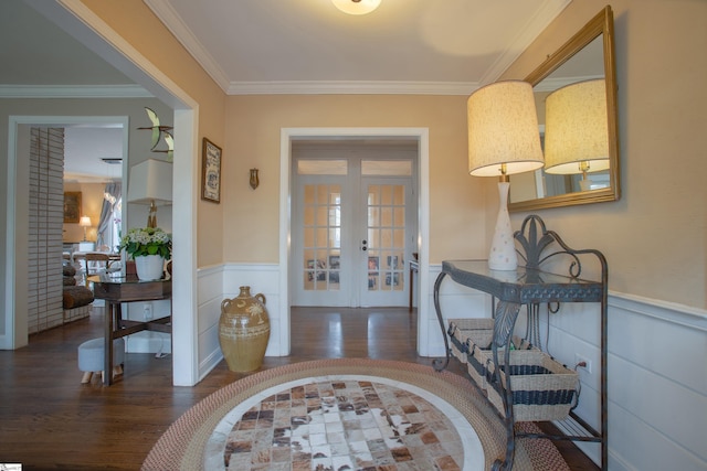 entryway with ornamental molding, french doors, and dark hardwood / wood-style floors