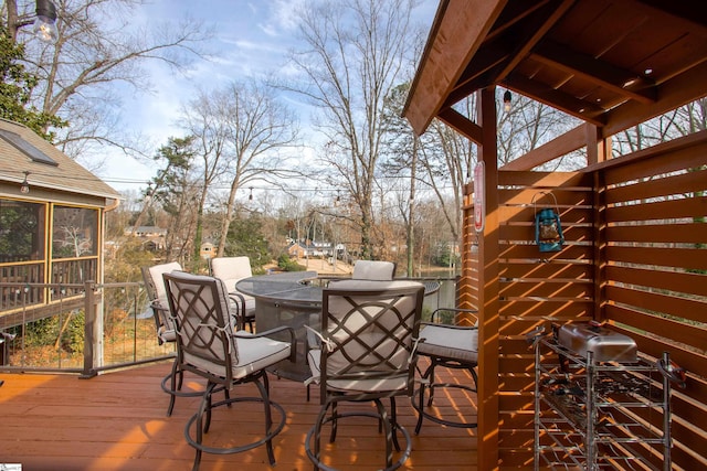 wooden terrace with a sunroom