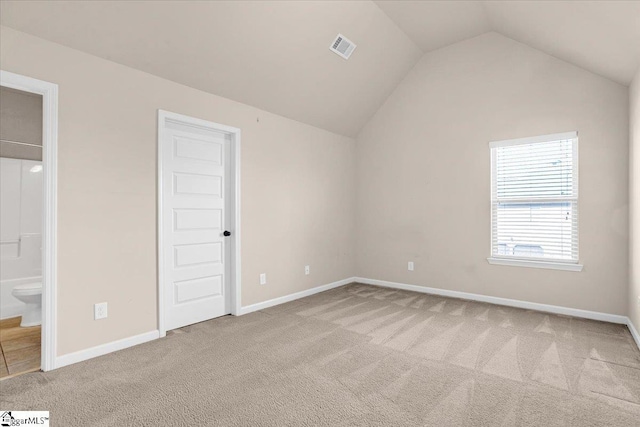 additional living space with light carpet and lofted ceiling