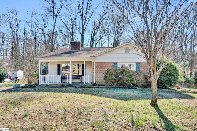 view of front of home with covered porch and a front yard