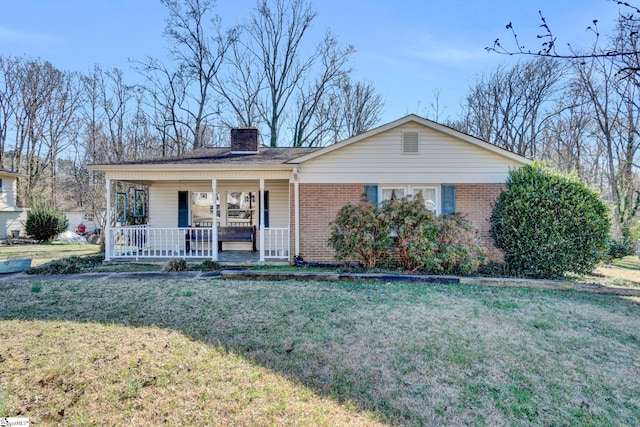 single story home with a front yard and a porch