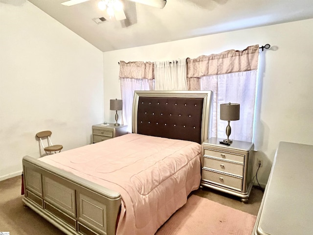 bedroom with ceiling fan, vaulted ceiling, and light colored carpet