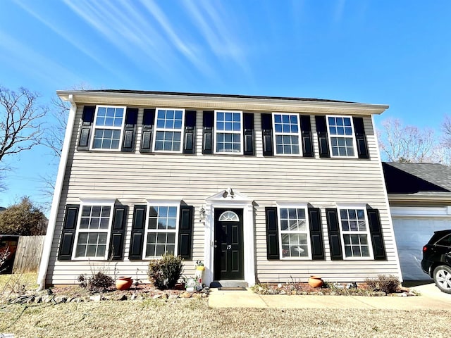 colonial home featuring a garage