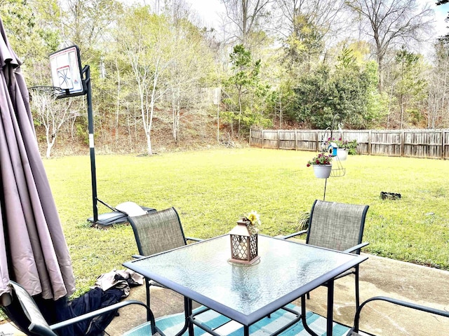 view of patio / terrace featuring outdoor dining space and fence
