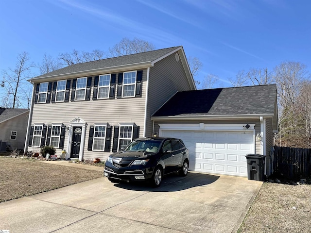 colonial home featuring a garage