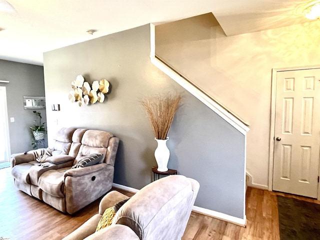 living area with hardwood / wood-style flooring