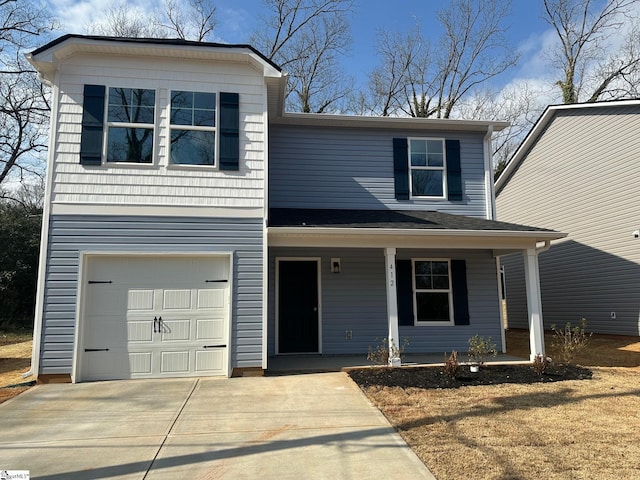 view of front of house with a garage and a porch