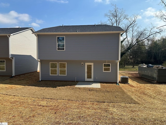 back of house with a patio area and central air condition unit