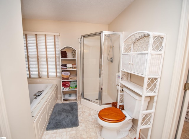 bathroom featuring shower with separate bathtub, toilet, and a textured ceiling