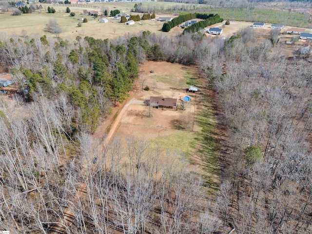 birds eye view of property with a rural view