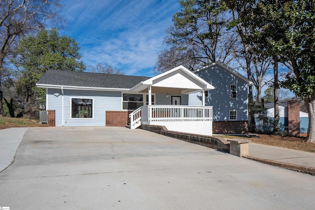 view of front of house featuring central air condition unit and a porch