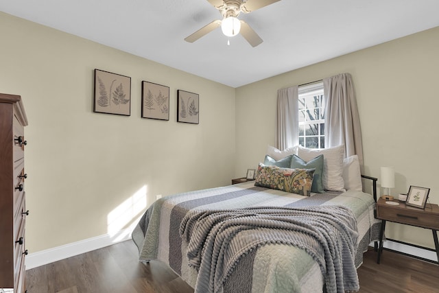 bedroom featuring ceiling fan and dark hardwood / wood-style flooring