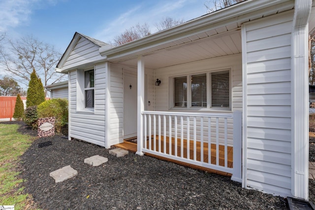 entrance to property featuring a porch