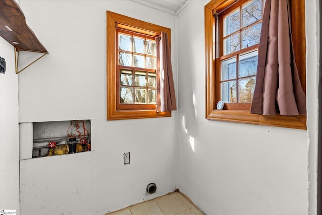 laundry area with plenty of natural light and hookup for an electric dryer