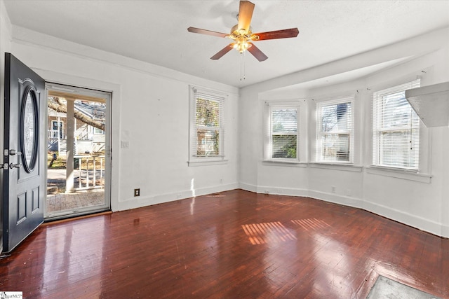 spare room with ceiling fan and wood-type flooring