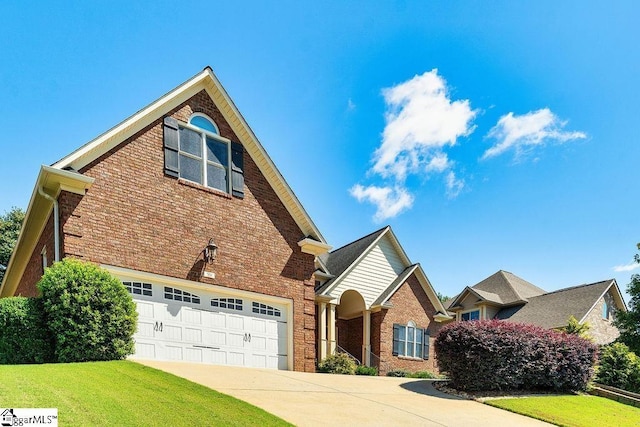 view of front property with a garage and a front lawn