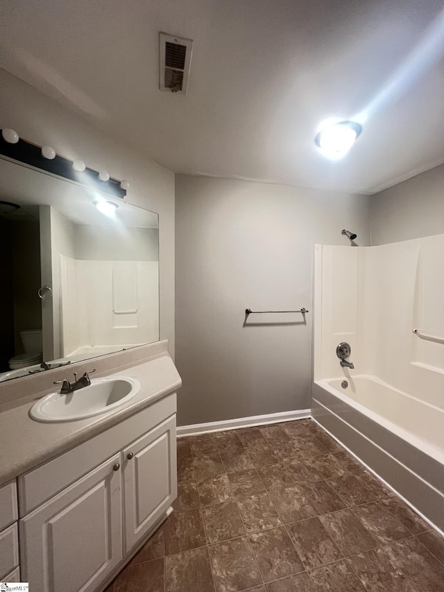 full bathroom with toilet, bathing tub / shower combination, and vanity