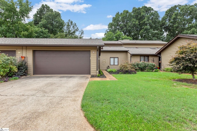 view of front facade with a front lawn and a garage