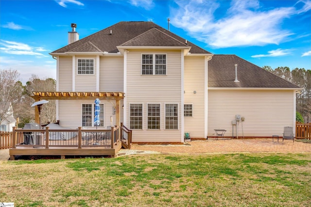 back of property featuring a patio, a yard, and a wooden deck