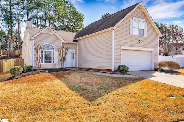 view of front of property featuring a front lawn and a garage