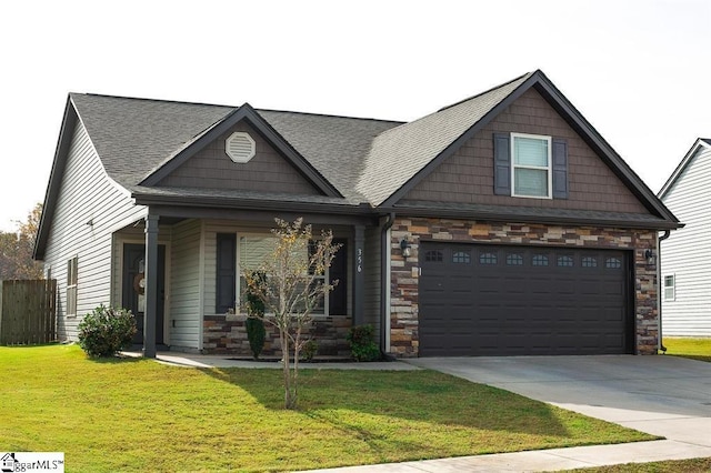 craftsman-style house featuring a garage and a front lawn