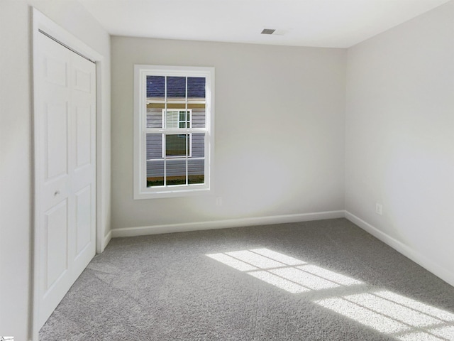 10 Maplecroft St, Greenville, SC 29609 - spare room featuring light colored carpet, visible vents, and baseboards