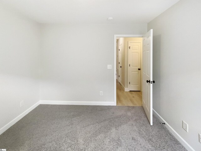10 Maplecroft St, Greenville, SC 29609 - spare room with light carpet and baseboards